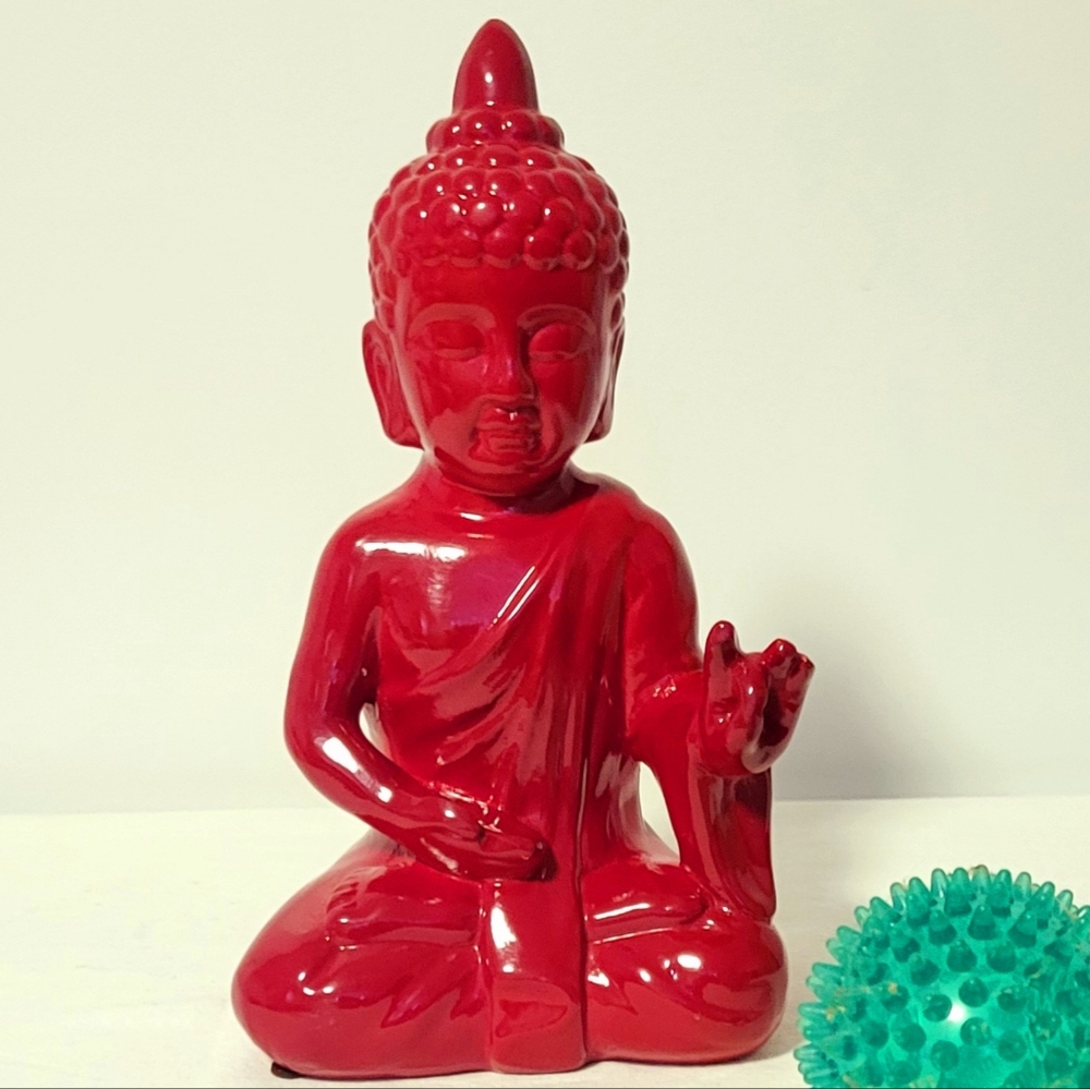 Beautiful decorative Statue in red ceramic of Shakyamuni Buddha in meditation